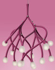 Pink chandelier with multiple light bulbs on a pink background