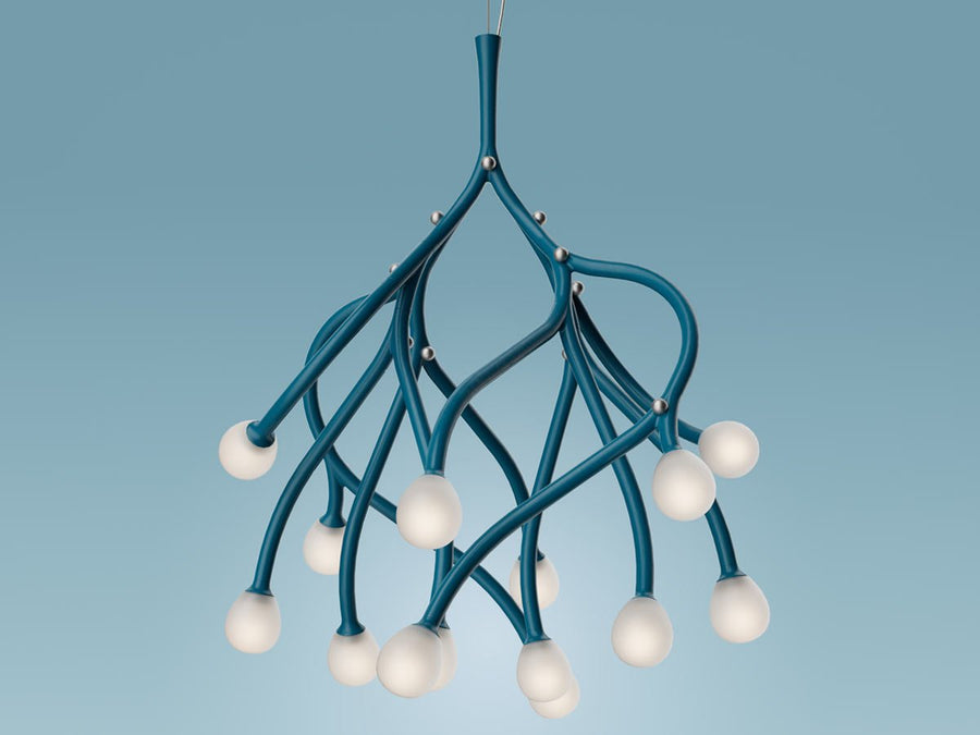 Modern teal chandelier with white bulbs on a blue background
