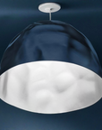 Dark blue pendant light with white interior on a dark background