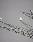 Close-up of a suspension lamp from Foscarini against a gray background