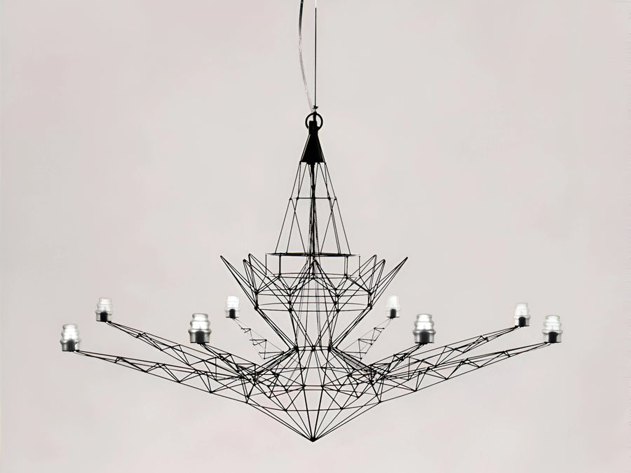 Modern chandelier with geometric design on a plain background