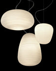 Three pendant lights with a textured design on a black background