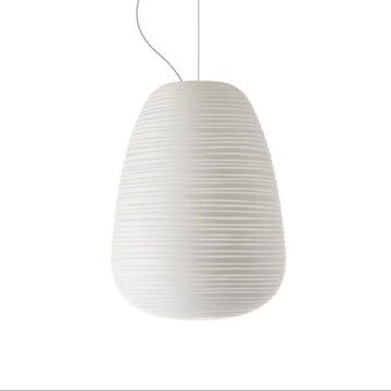 White pendant lamp with a ribbed texture on a white background from Foscarini available at Spacio retail stores in Mumbai & Kolkata. 