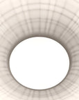 Close-up of a white ceiling light fixture with geometric design