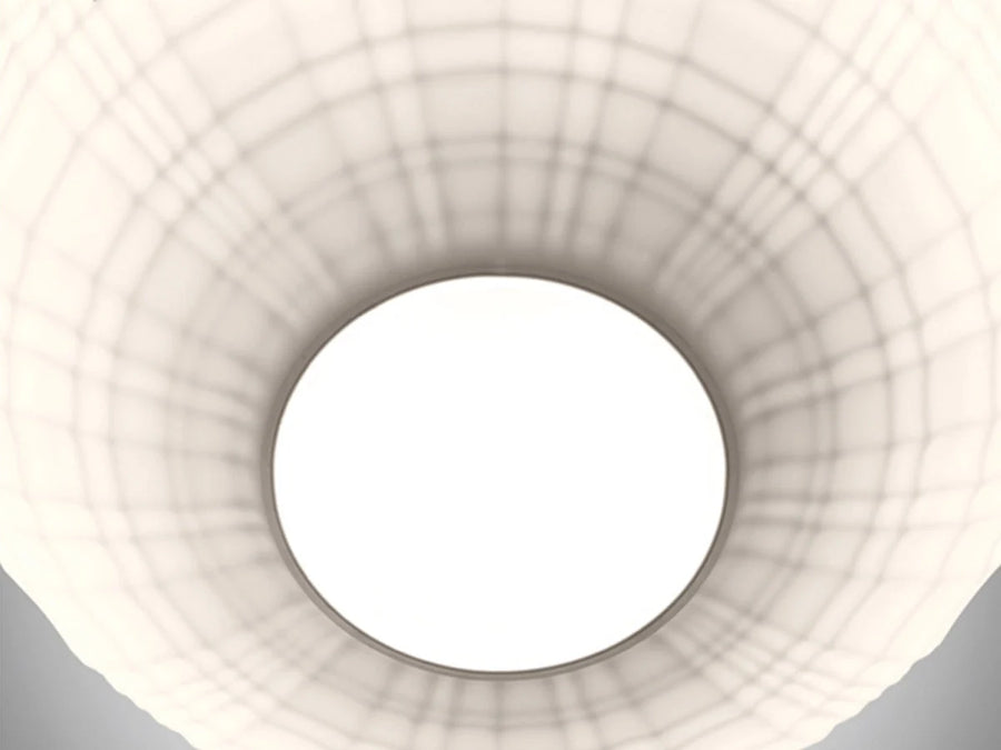 Close-up of a white ceiling light fixture with geometric design