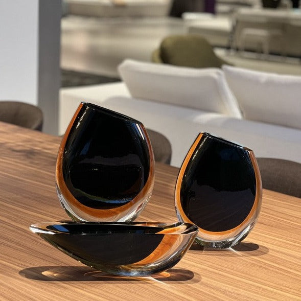 Three Gardeco Glass Bowl Cance 160 Black Amber vases, sculptural objects that are sure to elevate the aesthetic of any room.