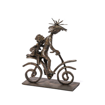 Bronze sculpture of a couple on a bicycle with a white background