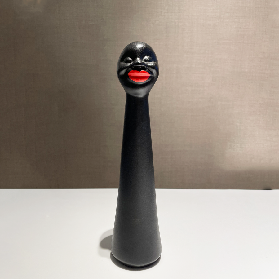 Gardeco Negritas Sorridente in Ceramic on a table available at Spacio India from the Luxury Homes Collection of Decor Accessories & Sculpture Art Objects.