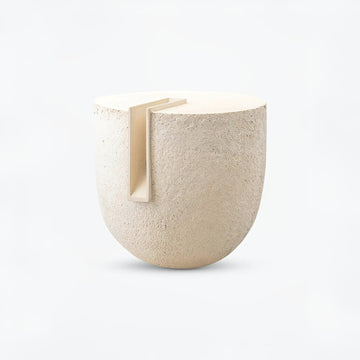 Beige ceramic sculpture Clausa Forma from Gardeco with a small rectangular opening on a white background available at Spacio retail stores in Mumbai & Kolkata
