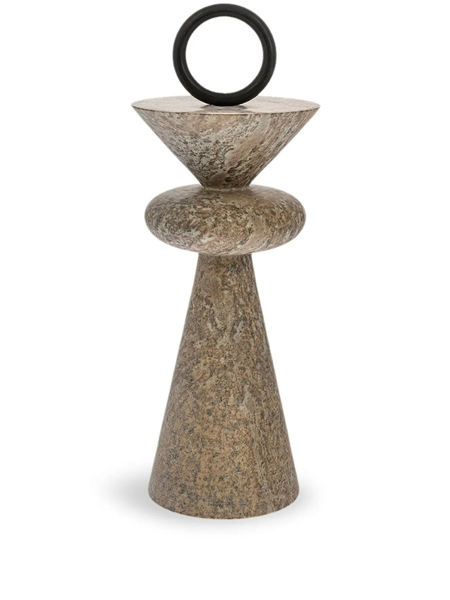 Decorative stone sculpture with a black circular top on a white background