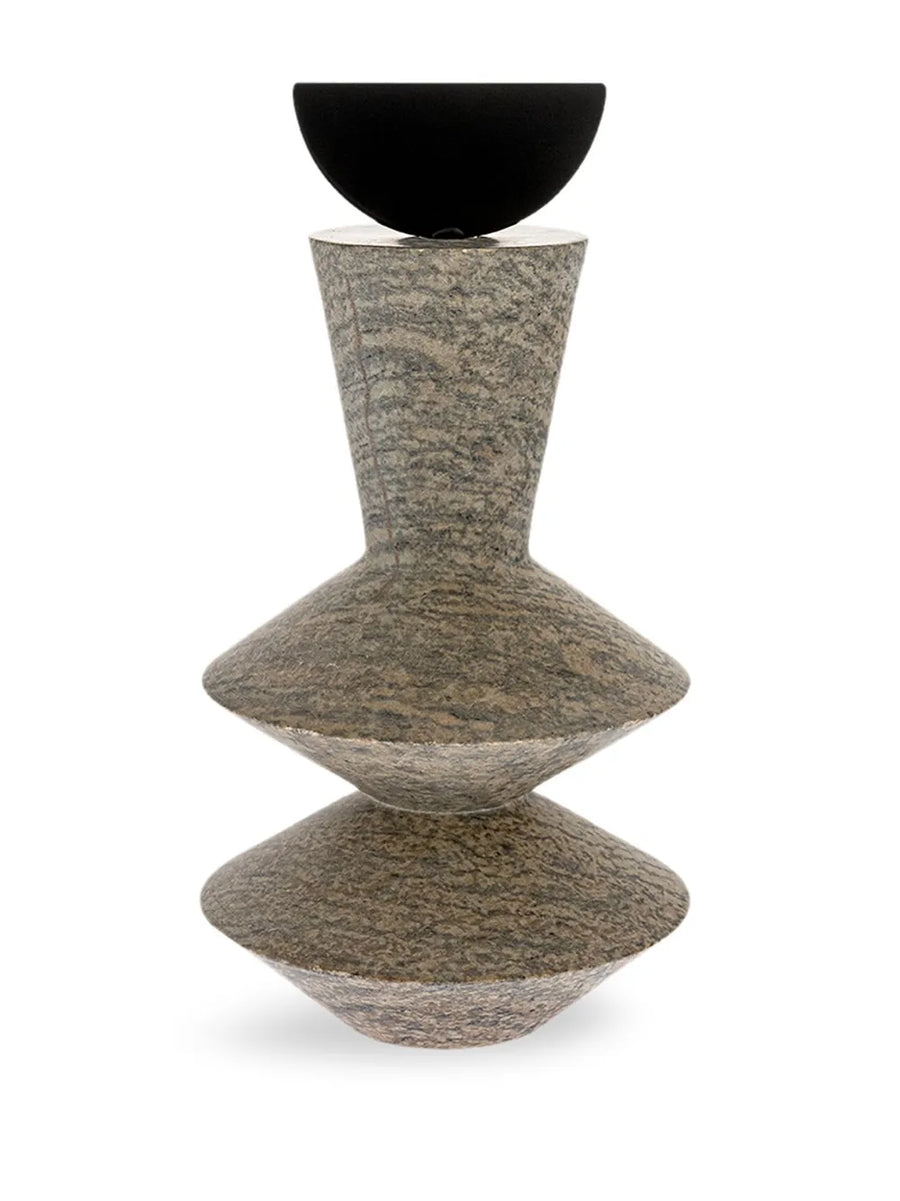Decorative mixed media sculpture with a black metal and textured grey soap stone on a white background, from Gardeco available at Spacio retail store in Mumbai & Kolkata. 