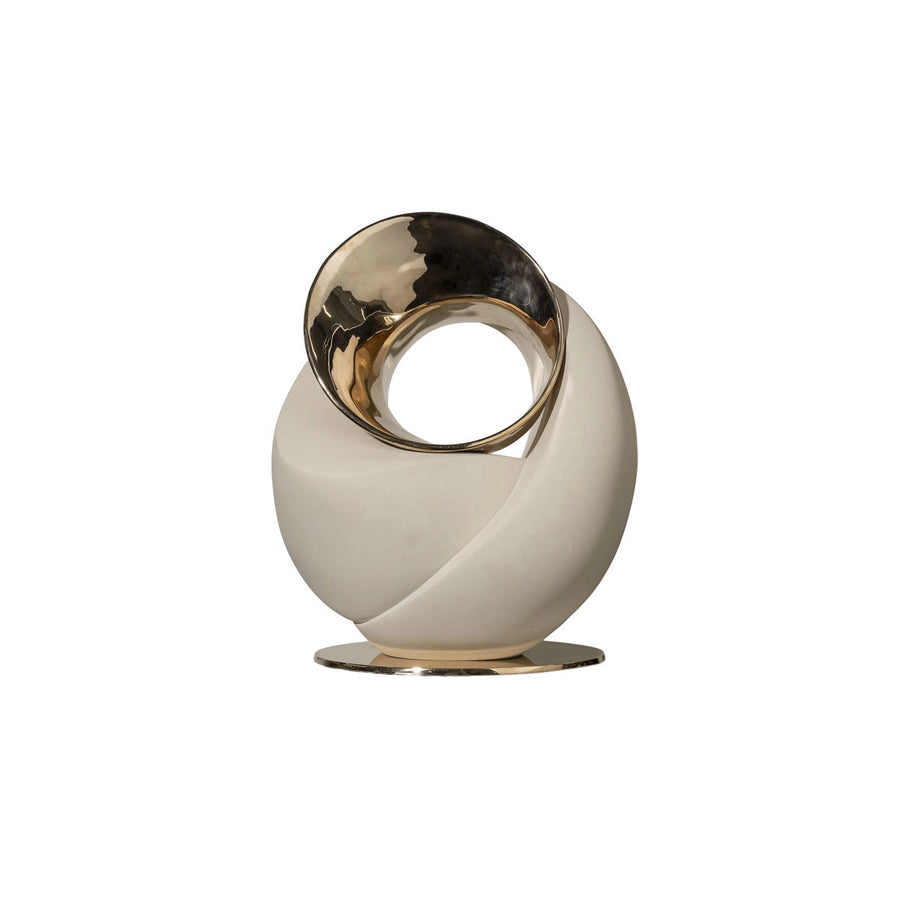 Decorative sculpture with gold and white design on a white background