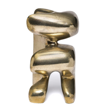 Polished bronze abstract sculpture on a white background