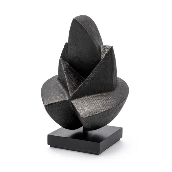 Black abstract sculpture on a white background
