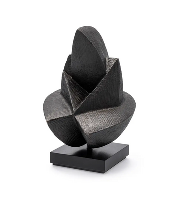 Black abstract sculpture on a white background