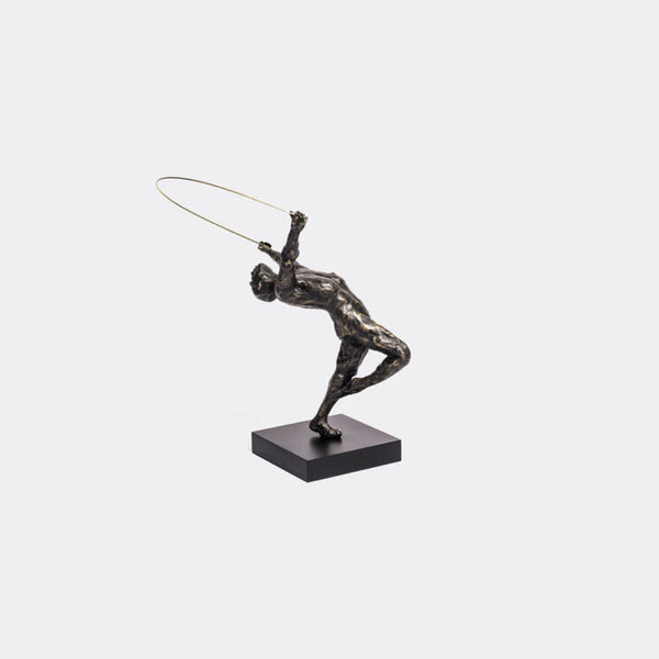 Bronze sculpture of a figure with a hoop on a white background