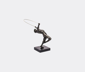 Bronze sculpture of a figure with a hoop on a white background