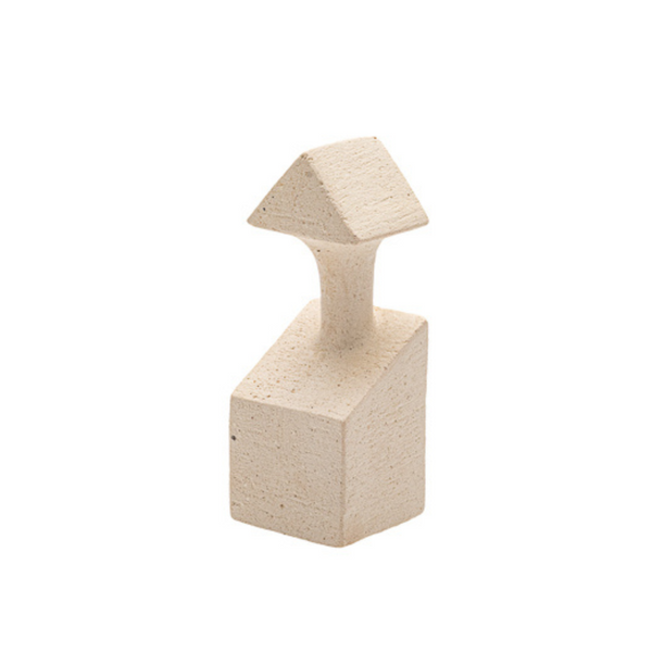Beige stone block with a triangular top on a white background