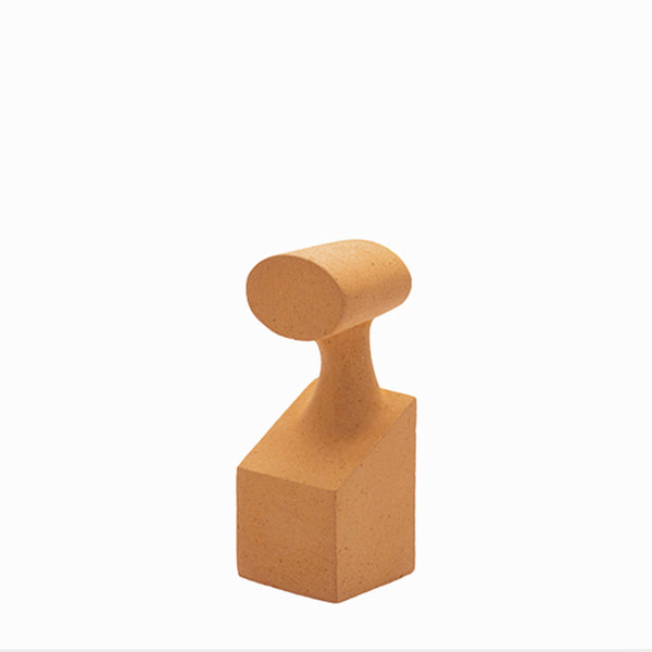 A Gardeco Ceramic Sculpture The Muses Small Euterpe Ochre with a rounded shape on a white background, showcasing an Ochre Finish.