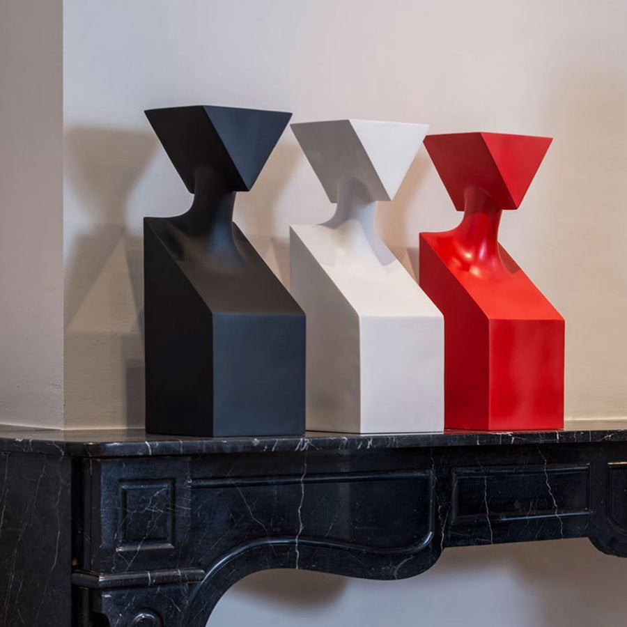 Three elegant Gardeco Ceramic Sculpture The Muses Thalia Red contemporary art vases on a mantel.