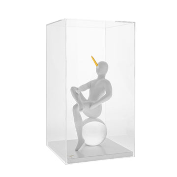 Abstract sculpture - The Pinnochio from Gardeco of a figure on a sphere inside a clear box on a white background available at Spacio retail stores in Mumbai & Kolkata
