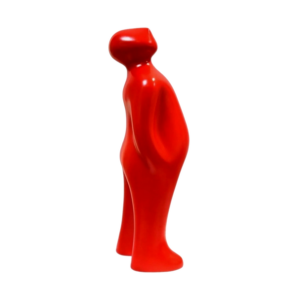 Red ceramic sculpture of a standing person on a white background