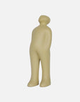 A small figurine of a man standing on a white background, created by Gardeco Ceramic Sculpture Visitor Small Sand Cor02, a Belgian sculptor.