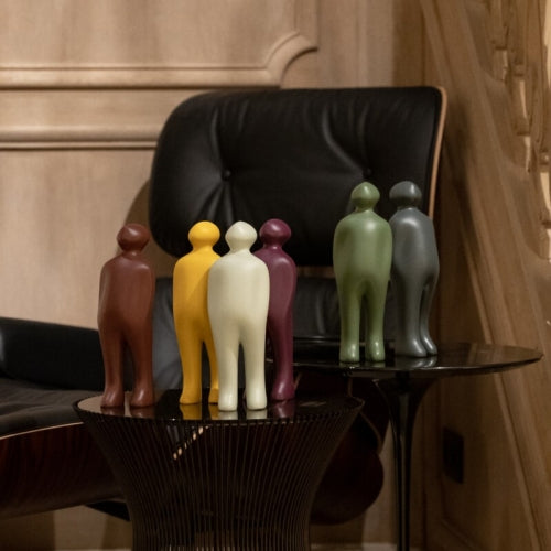 A group of Gardeco Ceramic Sculpture Visitor Small Verde Cor 52, created by a Belgian sculptor, beautifully displayed on a table vailable at Spacio India from Sculpture and Art Objects Collection.