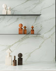 A white marble shelf with Gardeco Ceramic Sculpture The Muses Plus Calliope Ochre figurines on it.