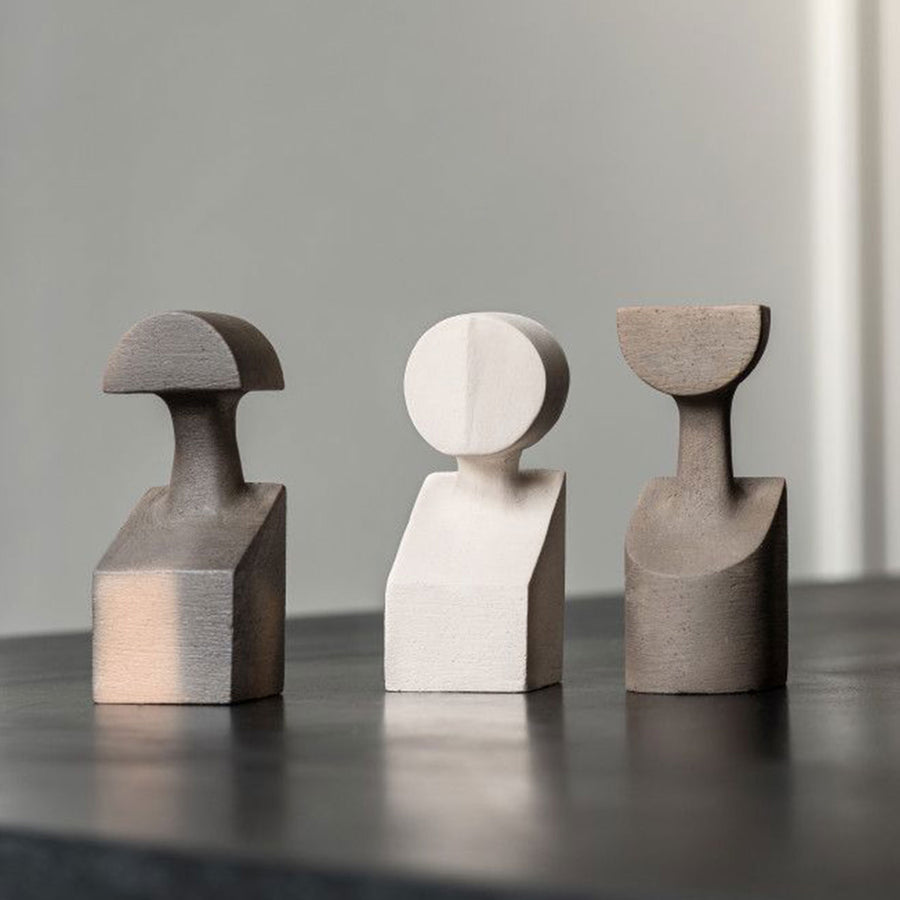 Three Gardeco Ceramic Sculpture The Muses Plus Clio White figurines in a White finish sitting on top of a table.