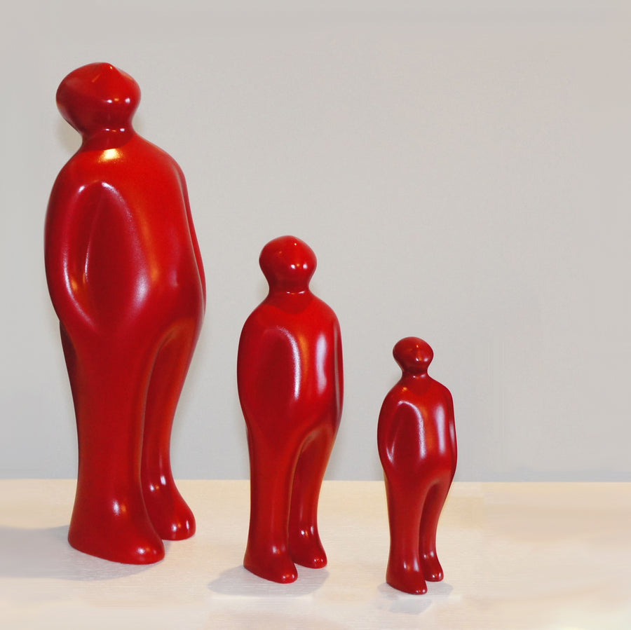 Three Gardeco Ceramic Sculpture Visitor Small Red Urucum, standing next to each other as an exceptional art display.