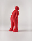 A Gardeco Ceramic Sculpture Visitor Small Red Urucum titled "The Visitor" standing in front of a white background.