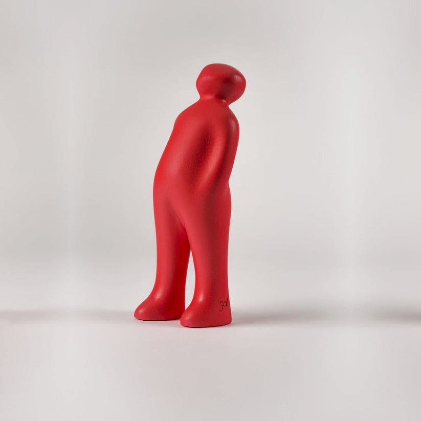 A Gardeco Ceramic Sculpture Visitor Small Red Urucum titled "The Visitor" standing in front of a white background.