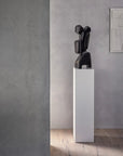 Minimalist interior with Gardeco Sol Bronze Sculpture displayed on pedestal, symbolising modern abstract art at Spacio India retail stores.