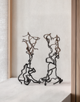 Pair of Gardeco To Return limited edition bronze sculptures styled on a ledge, luxury home art pieces available at Spacio India retail stores.