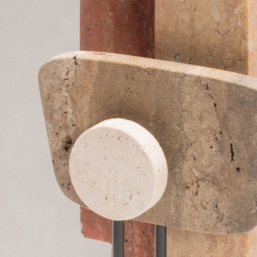 Close-up of a stone sculpture on a plain background