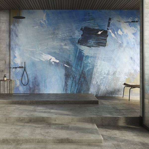 A bathroom with a blue wall adorned with Glamfusion Spilia, promoting a sense of wellness and tranquility in interior spaces. (Brand: Glamora)