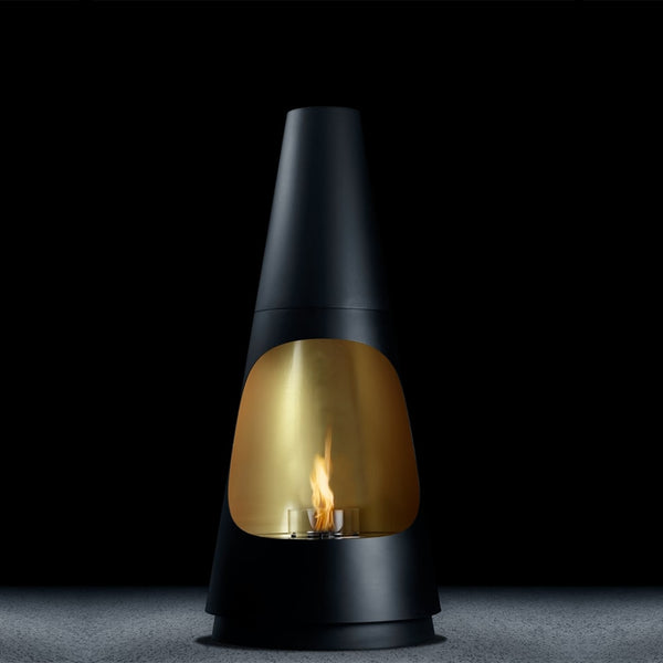 Black and gold fireplace with visible flame on a dark background