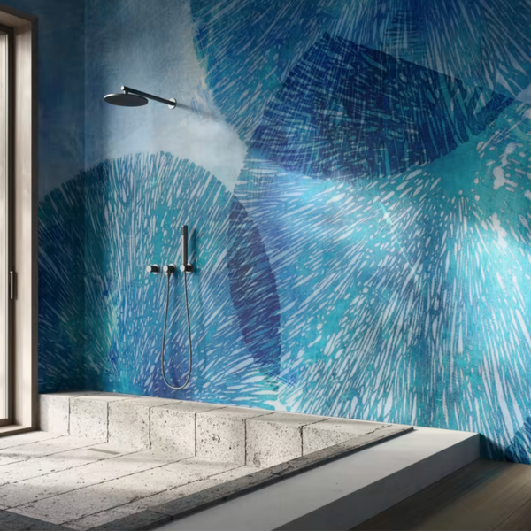 An interior bathroom with a blue tiled wall, promoting wellness and featuring the Glamfusion Hydra Hydronetta from Glamora Collection.