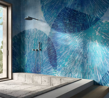 An interior bathroom with a blue tiled wall, promoting wellness and featuring the Glamfusion Hydra Hydronetta from Glamora Collection.