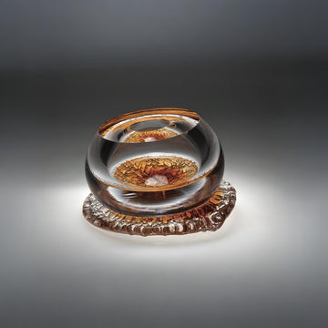 Glass object on a gradient gray background from Glasremis of Lithuania available at Spacio retail store in Mumbai. 
