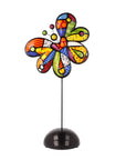 Colorful butterfly-shaped clock on a white background
