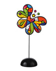 Colorful butterfly-shaped decorative item on a black stand against a white background by Romero Britto available at Spacio retail and online stores in India. 