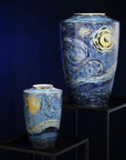 A pair of Starry Night Porcelain Vase Limited Edition by Vincent van Gogh on a black pedestal against a dark blue back ground available at Spacio India from the heirloom collection of Luxury Home Decor Accessories