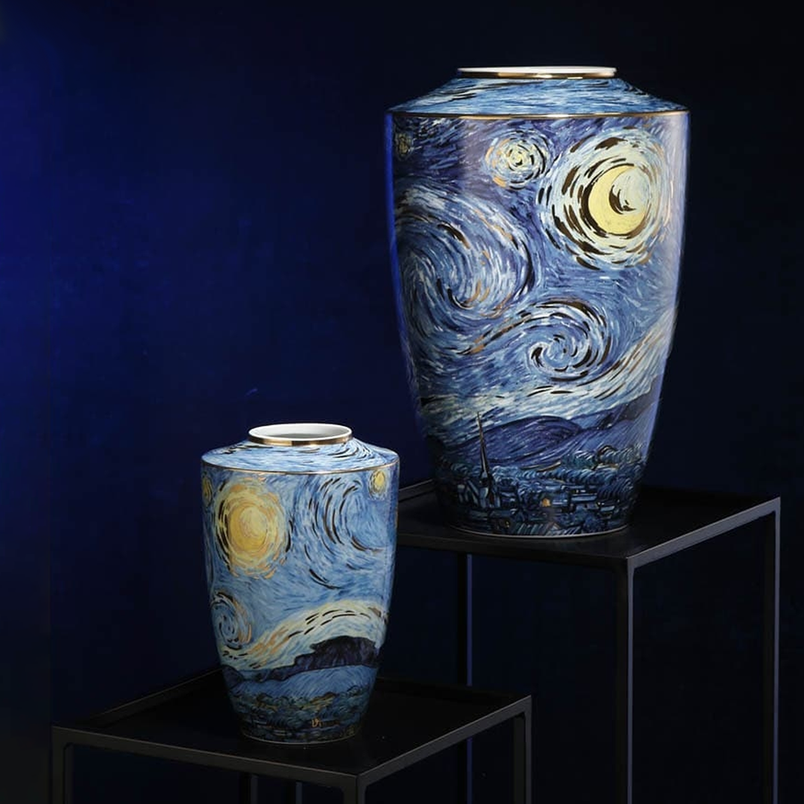 A pair of Starry Night Porcelain Vase Limited Edition by Vincent van Gogh on a black pedestal against a dark blue back ground available at Spacio India from the heirloom collection of Luxury Home Decor Accessories