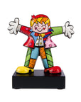 A colorful figurine of a Goebel Romero Britto Hug Too porcelain sculpture with his arms outstretched.