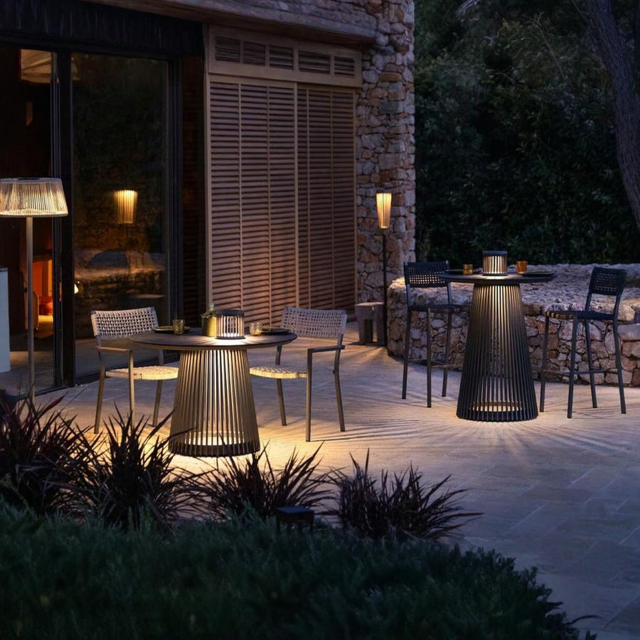 Outdoor patio setting with chairs and tables integrated with solar lighting rom Les Jardins available at Spacio retail stores in Mumbai & Kolkata.