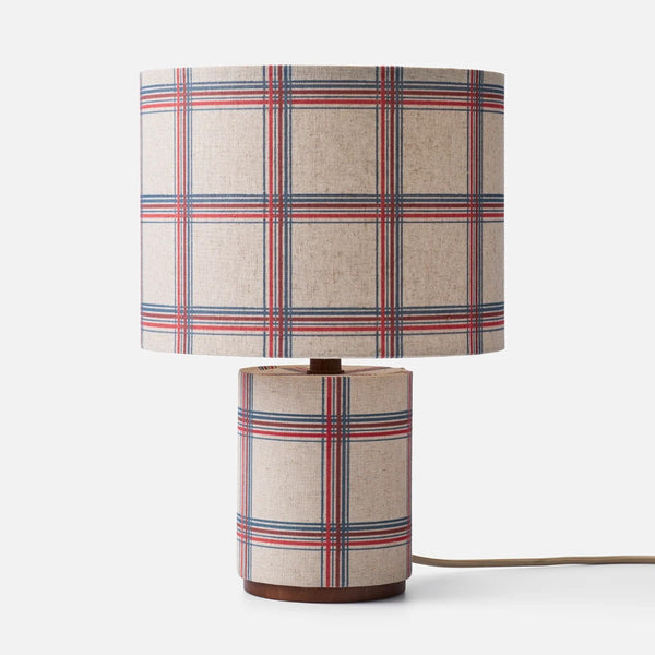 A checkered pattern fabric table lamp on a white background