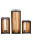 Three solar lights with wooden slats on a white background by Les Jardins available at Spacio retail stores in Mumbai & Kolkata. 