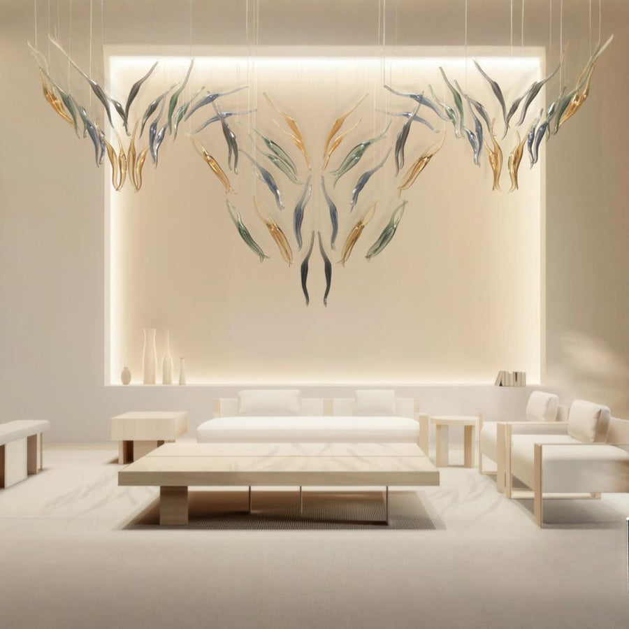 Modern living room with abstract wall art,  minimal furniture and a fluid art light installation by Iris Cristal, available at Spacio retail stores in Mumbai & Kolkata.